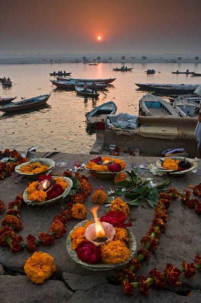 Varanasi, the ancient city on the banks of the sacred Ganges River, is a vibrant tapestry of spirituality, culture, and history. With a history spanning thousands of years.At dawn, devotees and pilgrims gather at the ghats, the stone steps leading to the river, to witness the daily ritual of worship. The air is filled with the fragrance of incense, the sound of chanting, and the gentle lapping of the holy waters. The city's rich cultural heritage is showcased in its ancient templesdedicated to L Indian Temple Aesthetic, Chath Pooja Image, Temple Aesthetic, Chhath Puja Photo, Ganges River, Kumbh Mela, Temple Photography, Stone Steps, Tour Around The World