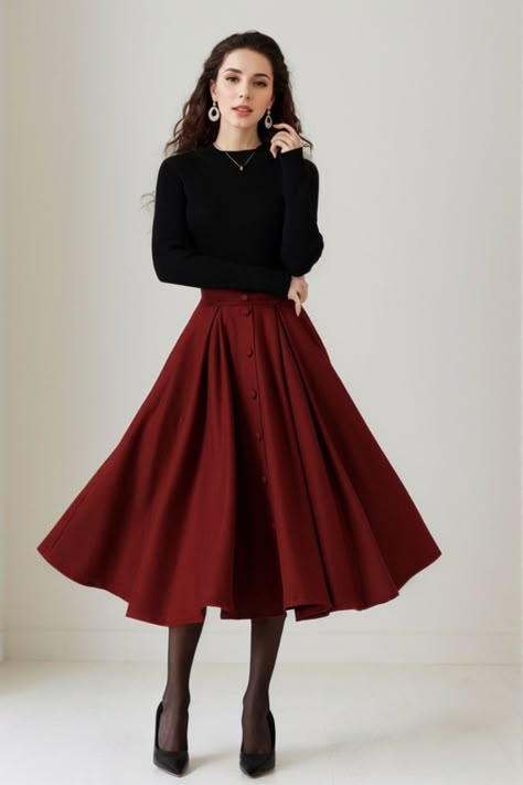 This skirt effortlessly combines style and comfort. The A-line silhouette offers a flattering fit, while the high-quality wool fabric ensures warmth and softness. The button-down detail adds a touch of sophistication to this versatile skirt, suitable for various occasions. DETAIL * 30% wool, 30% fiber, 40% polyester * fully satiny liner * Two side pockets * Right zip closure * elastic band at the back to provide some stretch * Plus size full skirt * Mid calf length * Perfect for Winter, autumn * Learn More about the items From the FAQs on the page bottom MODEL SIZE Bust 85 cm(33.4")  Waist 67 cm(26.7")  Height 168cm (5' 6") She wears size XS CUSTOM MADE SERVICE If you * Change other color * Can't find your size in our size Chart * Change the Style * Change the length * Your Height is not B Burgundy Wool Skirt, Midi Skirts Ideas, Cute Skirt Winter Outfits, Fall Thanksgiving Outfits For Women, Midi Wool Skirt Outfit, Full Circle Skirt Outfit, Burgundy Holiday Outfit, Vintage Inspired Fall Outfits, Romantic Feminine Style Outfits