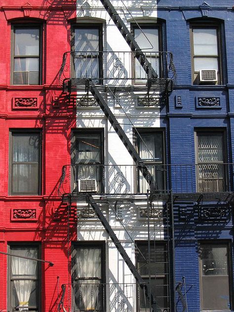 Red, White & Blue Building with black fire escape stairs Blue Apartment, Building Aesthetic, Blue Building, Fire Escape, French Flag, Home Of The Brave, A Flag, Black Fire, Land Of The Free