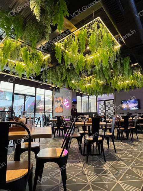 Your coffee shop doesn’t have to look like a coffee shop. It could be a lively, vibrant space that’s inviting and warm. Add artificial plants 🌱 and you can recreate this feeling indoors! Indoor Cafe Design, Coffee Shop Ceiling Design, Coffee Shop Plants, Modern Cafe Interior Design, Restaurant Design Inspiration, Modern Restaurant Design, Outdoor Restaurant Design, Coffee Shop Interior Design, Coffee Shops Interior