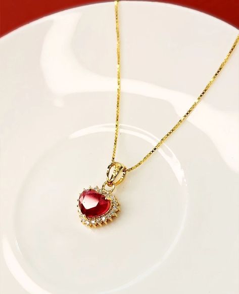 The Delnaz Heart Pendant embodies not just elegance but also the depth of emotions, making it an ideal token to showcase your adoration for your beloved. Adorned with a resplendent Ruby embraced by a delicate halo of shimmering diamonds, it symbolizes a love that's as rare and precious as the gemstones it holds. Whether gifted as a romantic gesture or a timeless symbol of affection, it's a piece that resonates with love's eternal charm. Let its beauty be a reminder of your enduring love st... Timeless Symbol, Romantic Gestures, A Romantic, A Love, Heart Pendant, Halo, Ruby, Diamonds, Let It Be