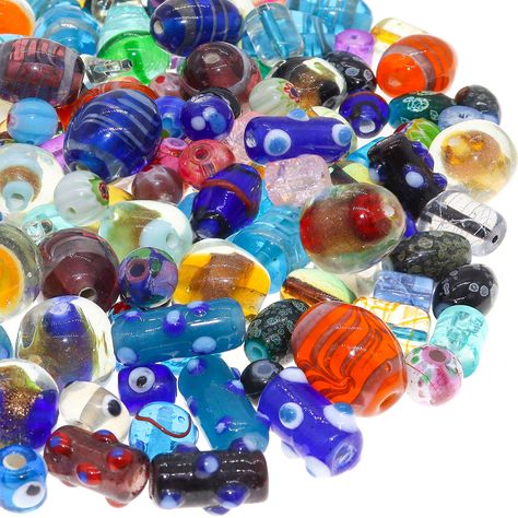 PRICES MAY VARY. Beautiful glass bead mix of lampwork murano and other unique glass beads. Assorted small and large jewelry making beads for crafts, necklace beads, bracelet beads, and other jewelry making projects. DIY jewelry making is a fun way to express your inner fashonista 50 PCS bulk glass beads mix - various bead and hole sizes for a variety of unique beading projects Crafting beads with colorful designs and shapes. Perfect for Instagram or Etsy small shop owners! 50 PCS Bulk Assorted G Beads For Sale, Rainbow Crafts, Art Hobbies, Bracelets And Necklaces, Jewelry Making Project, Necklace Craft, Crafting Supplies, Beading Projects, Glass Beaded Bracelets