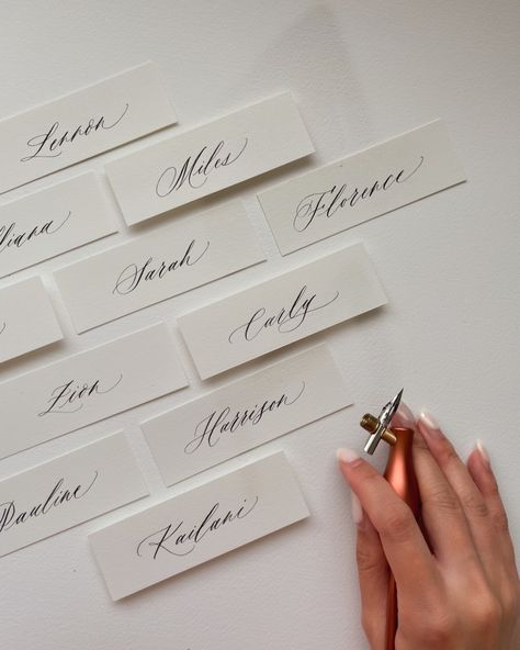 Imagine your guests finding their seat and being greeted by their name, written thoughtfully in calligraphy. These small touches go a long way in making your event unforgettable ♡ #detailsmatter #weddingplacecards #minimalistplacecards #rosemaystudio #nzcalligrapher #weddingcalligrapher #weddingstationery #minimalplacecards #placecards Wedding Caligraphy, Cards With Flowers, Calligraphy Names, Table Name Cards, Invitation Fonts, Table Name, Calligraphy Name, Free Script Fonts, Seating Cards