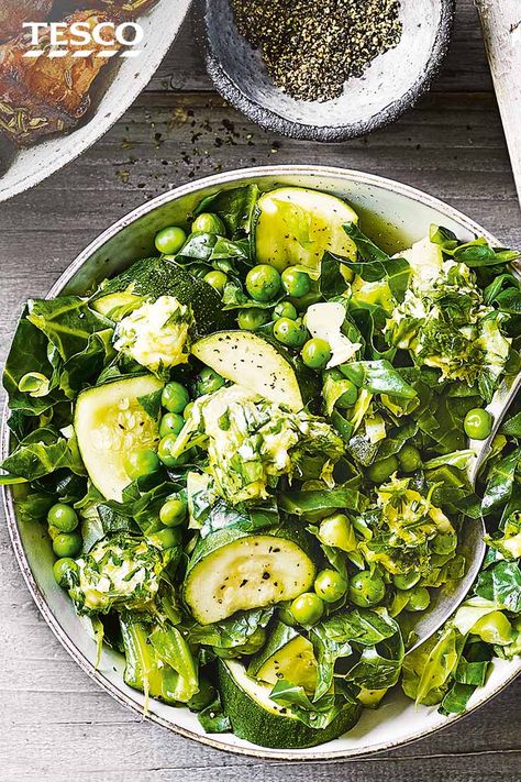 Make eating your greens interesting with this citrussy steamed greens medley. Steam spring greens, sweet peas and courgettes so they keep their vibrant colour, then melt through a herby citrus butter for a finishing flourish. | Tesco Green Vegetable Recipes, Brain Healthy Foods, Tesco Real Food, Steamed Vegetables, Tasty Vegetarian Recipes, Vegetable Sides, Greens Recipe, Spring Recipes, Side Recipes