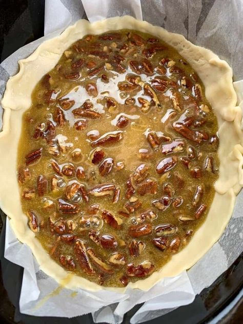 This is an easy recipe for slow cooker pecan pie. The classic dessert is made with candied pecans, an ooey gooey center, and a flaky pie crust. Pecan Pie Crockpot, Pecan Crockpot Dessert, Pecan Cobbler Crockpot, Crock Pot Pecan Pie Cobbler, Slow Cooker Pecan Pie, Pecan Pie In Crockpot, Crock Pot Pecan Pie, Crockpot Pecan Pie Cobbler, Crockpot Pecan Pie