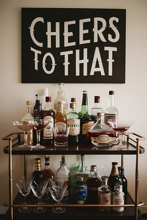 Bar cart stocked with various liquors, mixers, and glassware for creating cocktails at home Bar Station Home, Living Room Cocktail Bar, Small Bar Corner, Cocktail Bar Ideas Home, Cocktail Bar Apartment, Cocktail Bar Kitchen, Bars In House, Bar Ideas In Living Room, Drinks Bar Ideas Home