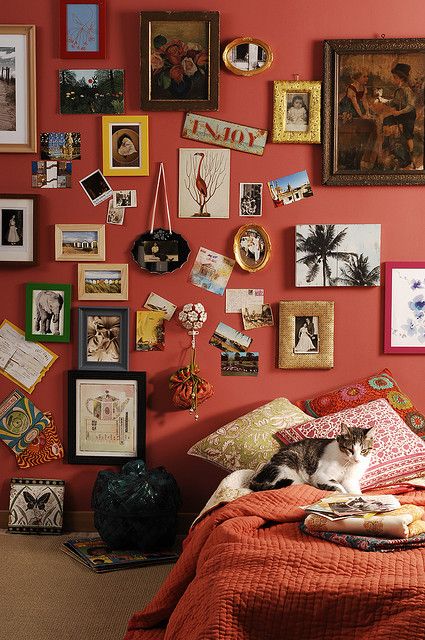 OBSESSED with this arrangement of photos and other knick-knacks and the color of this wall!  (via the Interior Styling group on Flickr; photographed by Engin Yildiz, styled by Gozde Eker) Bohemian Bedroom Diy, Wes Anderson Decor, Bohemian Bedrooms, Bedroom Ideas Hippie, Teen Girl Bedroom, Red Wall, Deco Boheme, Bohemian Bedroom, Wes Anderson