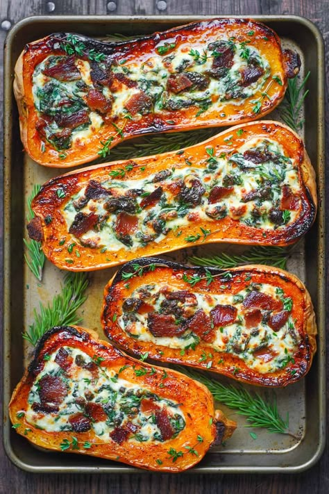 stuffed butternut squash with spinach, bacon, and cheese on a baking sheet Chicken Stuffed Butternut Squash Recipes, Sunday Winter Dinner Ideas, Squash Boats Stuffed, Stuffed Butternut Squash Recipes, Fall Sunday Dinner Ideas, Butternut Squash With Spinach, Vegan Thanksgiving Main, Longevity Foods, Witchy Recipes