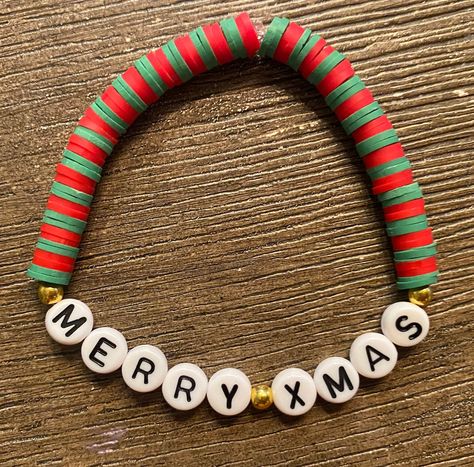 A Red and green beaded bracelet that says "Merry Xmas" Perfect Christmas gift!  Fits small wrists (teens, young adults, older kids) Xmas Bracelets Clay Beads, Holiday Bracelet Ideas, Christmas Clay Bead Bracelet Ideas, Xmas Bracelets, Handmade Jewelry Display, Holiday Bracelets, Green Beaded Bracelets, Christmas Clay, Bead Projects