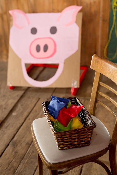 Kara's Party Ideas Glam Barnyard Birthday Bash | Kara's Party Ideas Pig Themed Party Games, Feed The Pig Bean Bag Toss, Barnyard Party Games, Barnyard Birthday Party Girl, Ag Olympics, Farm Party Games, Piggy Birthday Party, Farmyard Birthday, Barn Birthday Party