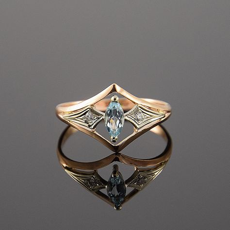 Art deco ring, Topaz ring, Gold art deco ring, Topaz ring gold, Blue stone ring, Blue topaz ring, Geometric ring by JewelryAsteria on Etsy https://www.etsy.com/listing/255354124/art-deco-ring-topaz-ring-gold-art-deco Gold Topaz Ring, Topas Ring, Bijoux Art Deco, Bijoux Art Nouveau, Ring Marquise, Engagement Ring Rose Gold, Marquise Ring, Blue Stone Ring, Art Deco Engagement