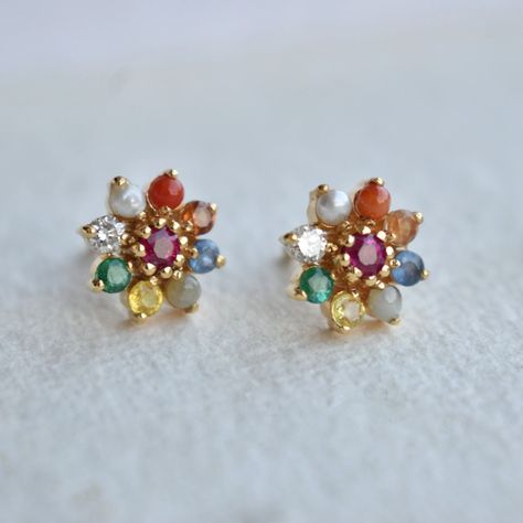 Kalyan Jewellers offers pure and high-quality navaratna earrings in gold. Explore the astro jewellery collections from the most trusted jewellers. Navratna Earrings Gold, Navarathna Ear Rings, Navarathan Earrings, Astrology Mythology, Navratna Earrings, Navratna Jewellery, Gold Earrings Indian, Antique Gold Earrings, Ruby Earrings Studs