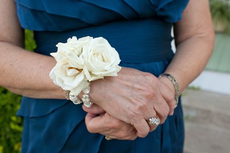 The mothers and grandmothers will have wrist corsages of ivory spray roses and gold seeded eucalyptus on a pearl beaded bracelet. Mother Corsage Wedding Wristlets, White Wedding Corsages For Mothers, White Rose Corsage Wrist, Corsage Wedding Mother, White Rose Corsage, Wedding Wristlets, Pink Astilbe, Rose Wrist Corsage, Corsages Wedding