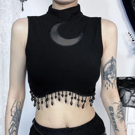 1-10 Which top fits your style? Get them at rockndollstore.com. 🦇🖤🦇 🦇FREE SHIPPING Worldwide🦇 . . . #gothclothes #altgoth #alternativelook #goth #gothic #gothgirl #alternativestyles #gothootd #fashionideas #gothaesthetic #gothfashion #darkfashion #gothlife #gothvibes #ootd #altfashion #gothbabe #gothmodel #gothstyle #black #metal #metalgirl #gothicstyle #metalheadgirl #outfitinspo #gothicfashion #outfitinspiration #metalchick #gothgrunge #gothicgirl High Neck Sleeveless Top, Moon Chain, Moon Beads, Turtleneck Tank Top, Beaded Crop Top, Geometric Clothing, Gothic Tops, Vest Crop Top, Middle Age Fashion