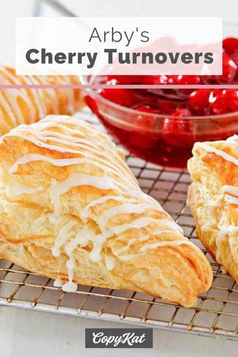 You have to see how easy it is to make cherry turnovers with puff pastry and pie filling. It's so simple to do with this Arby's copycat recipe and video. Delight your family and friends with a light and flaky dessert pastry. #turnovers #cherry #dessertrecipes #dessertideas #easydessert #copycat #copycatrecipe #puffpastry Cherry Turnovers With Puff Pastry, Fruit Turnovers, Turnovers With Puff Pastry, Cherry Turnover, Pastry Turnovers, Cherry Turnovers, Fast Dessert Recipes, Turnover Recipes, Blueberry Pie Filling