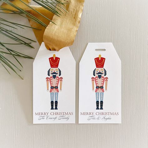 Elevate your holiday gifting with these gorgeous personalized tags and make any gift look extra special. This charming Nutcracker lends itself perfectly to a whimsical take on a traditional look. These are some of our most popular holiday tags loved by our clients and customers and they are now available to you. PRODUCT DETAILS: *TAGS COME IN A SET OF 12* SIZE: 2.25" x 4.50"  OPTIONAL holiday greeting - two choices PRE-PUNCHED special ribbon hole option BEVELED top corners PERSONALIZATION option Gift Tags Personalized, Christmas Gift Tags Personalized, Christmas Gift Tag, Holiday Tags, Everyday Gifts, Holiday Gift Tags, Holiday Greeting, Christmas Tags, Nutcracker Christmas