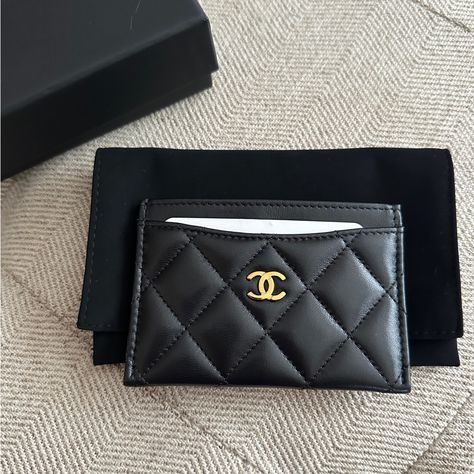 Classic Chanel Card Holder. 4 1/4" L 3" H 1/4" D. Black Lambskin Leather. Gold Tone Hardware. Exterior Is A Black Soft Lambskin Leather With Cc Logo At Front Along With 3 Card Slots. Interior Is A Burgundy Fabric With Room For Other Cards Or Money. New, Never Used. Includes: Chanel Box, Dust Bag, Care Booklet. Luxury Card Holder Women, Luxury Brand Accessories, Card Holder Chanel, Chanel Clothes, Chanel Products, Designer Card Holder, Chanel Card Holder, Purse Chanel, Classic Chanel