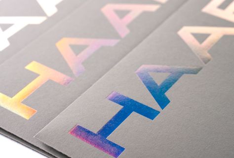 Visual identity design for the architecture studio from Germany - HAABS1.   Art Direction: ground  Consulting: Hugmun.studio  Type Foundry: Heavyweight  Print House: Dot Studio  Foils/Papers: Foilco / Colorplan  Photos: Kuba Szopka  #branding #graphicdesign #grounddesign #holographic #holographicprint #dotstudio Print Techniques, Holographic Paper, Holographic Print, Holographic Background, Rainbow Logo, Business Card Inspiration, Type Foundry, Visual Identity Design, Holographic Foil