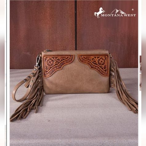 Introducing The Montana West Floral Tooled Fringe Wristlet Clutch/Crossbody Bag - Your New Go-To Accessory For Any Occasion! This Stylish Bag Measures 9.5 X 0.25" X 6.25" And Features Beautiful Floral Tooling And Trendy Fringe Details That Will Make You Stand Out From The Crowd. The Top Zipper Closure Ensures All Your Belongings Stay Secure, While The Inside Clutch Offers A Zippered Pocket And 3 Credit Card Slots For Organization On-The-Go. Need Some Extra Storage? There's An Additional Zipper P Trendy Fringe, Skull Wallet, Rodeo Fashion, Handbag Patterns, Floral Elements, Wristlet Clutch, Decorative Design, Crossbody Clutch, Stylish Bag