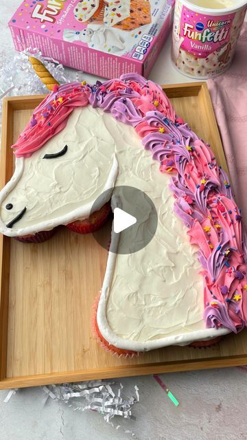 Pillsbury Baking on Instagram: "This Funfetti Unicorn Cupcake Pull Apart Cake is magically EASY to make! Uni-can do it!🦄⁠
⁠
Be sure to save the full recipe below!📩⁠
⁠
You’ll need...⁠
1 box Funfetti Strawberry Cake & Cupcake Mix⁠
Additional ingredients to prepare cake mix per box directions⁠
2 tubs Funfetti Unicorn Vanilla Frosting ⁠
4 piping bags⁠
Piping tips( two size 1M, one size 6, one 10)⁠
Black, pink and purple food color ⁠
Gold fondant⁠
⁠
Directions:⁠
1. Preheat oven to 350°F. Prepare cake mix following the package directions. You will need at least 13 cupcakes. ⁠
⁠
2. Let cupcakes cool and arrange in the shape of the unicorn head. With a piping tip remove center of cupcakes, set aside removed cake to replace after filling each cupcake with sprinkles. Re-Cover with the cake pieces. Pull Apart Unicorn Cupcake Cake Template, Unicorn Cake How To, Unicorn Birthday Cake And Cupcakes, Strawberry Unicorn Cake, Unicorn Pull Apart Cake, Unicorn Pull Apart Cupcakes Template, Unicorn Cupcake Cake Template, Unicorn Shape Cake, Cupcake Unicorn Cake