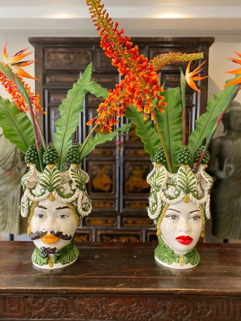 This 48cm Traditional Sicilian Ceramic Moro Head Vase showcases the intricate craftsmanship and vibrant colours of Sicilian pottery. Made with traditional methods, it features a beautiful green Pinecone design that adds a touch of Sicilian charm to any home decor. Bring a piece of Sicilian culture into your home with this hand-painted vase. H.48 L.28 Handcrafted Sicilian Bathroom Decor, Modern Sicilian Interior, Sicily Home Decor, Sicilian Home Decor, Sicilian Vase, Sicilian Interior, Sicily House, Sicilian Pottery, Sicilian Culture