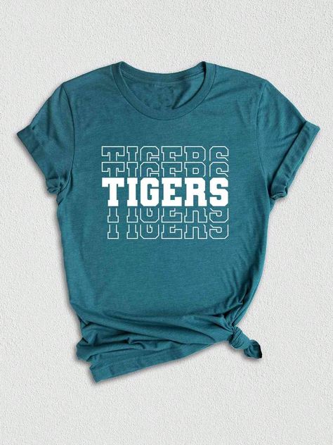 Introducing our Tigers Mascot Shirt, the perfect apparel for all the Tiger fans out there!  Whether you're a proud member of the Tigers team, a dedicated fan, or simply want to show your support, this shirt is a must-have addition to your collection. Designed with the iconic Tigers Mascot, this shirt captures the spirit and energy of your beloved team. Made with high-quality materials, this Tigers School Shirt is not only comfortable but durable as well. You'll love the softness of the fabric against your skin, making it ideal for everyday wear or game days.  In addition to being a stylish fashion statement, this Tigers Fan Shirt also makes for a great gift. Surprise your friends, family, or fellow Tigers enthusiasts with this unique and trendy graphic tee. Perfect for birthdays, holidays, High School Shirt Designs Spirit Wear, School Spirit Wear Ideas, School Mascot Shirt Ideas, Elementary School Tshirt Designs, College Tshirt Designs, School Graphic Tees, Softball Team Shirts, Spirit Wear Shirts, Spirit Wear Designs