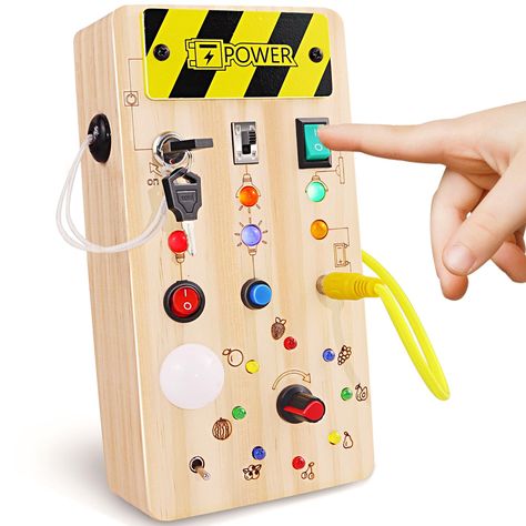 PRICES MAY VARY. LED Busy Board: The busy board with led light toy contains 8 different buttons and switches, all corresponding to unique LED lighting effects. The toddler light switch board toy include push button switches, toggle switches, twist switches, etc. LED lights come in a variety of classic colors, and some can even change color and speed. Super High Quality: This montessori busy board toy is made of high-quality natural wood, with rounded corners without any risk of injury, and the push button switch is durable and will not loose. In addition, we have specially designed the packaging for this wooden busy board toy to protect the LED lights and switches to ensure that the product will not be damaged during transportation. Safety first: To ensure the safety of your kids, we have Toddler Travel Toys, Montessori Board, Transportation Safety, Toddler Busy Board, Travel Toys For Toddlers, Switch Board, Toys Montessori, Busy Boards For Toddlers, Development Activities