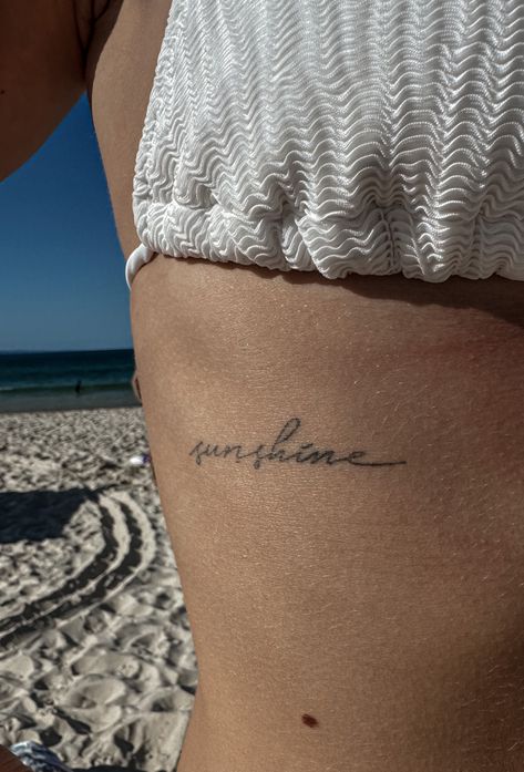 Dainty Tattoos Quotes, Word Sunshine Tattoo, Easy Does It Tattoo, I Am The Sun Tattoo, Beach Quotes Tattoo, Sunshine Cursive Tattoo, Sun Quotes Tattoo, Tattoo Area Ideas, Tattoo Ideas Sunshine