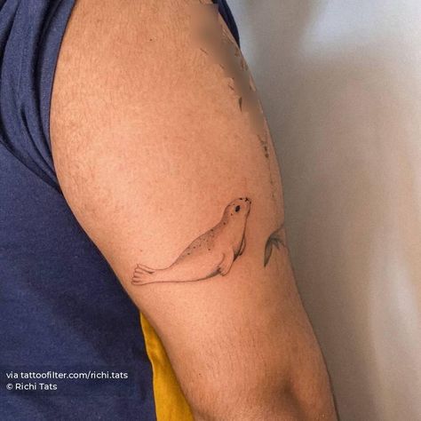 Micro-realistic seal tattoo on the tricep. Seal Tattoo Small, Marine Animals Tattoo, Seal Tattoo Simple, Puffin Tattoo, Community Tattoo, Tricep Tattoos, Seal Tattoo, International Tattoo, Duck Tattoos