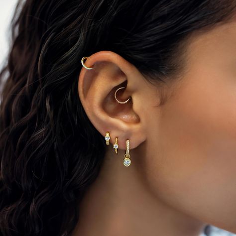 Most secure huggie earring has a hinge that is hidden when closed. Great for cartilage helix, tragus, rook, daith, septum and upper lobe piercings. 14K Gold Hypoallergenic, lead and nickel free Thickness 1mm, 18 gauge Endless Hoop Closure #JS010-G Hoops All The Way Up Ear, Cute Piercing Combinations, Detached Earlobe Piercings, Daith Piercing Hoop, Ear Piercings Upper Lobe, Gold Daith Piercing, Helix And Daith Piercing, Upper Cartilage Piercing, 3 Lobe Piercings Ideas