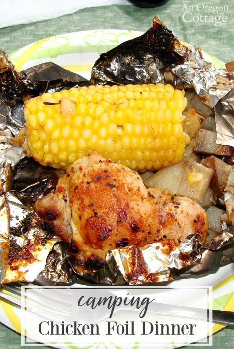 Easy Camping Chicken Foil Dinner makes camp meals a breeze. Prep the packets of chicken, potatoes, and corn at home, prepare a fire in the grate at the campsite and a complete dinner is done by the time you've set up camp! #camping #campfood #grilling Camp Meals, Campfire Breakfast, Foil Pack Dinners, Foil Pack Meals, Foil Dinners, Camping Breakfast, Foil Packet Meals, Camping Dinners, Easy Camping Meals