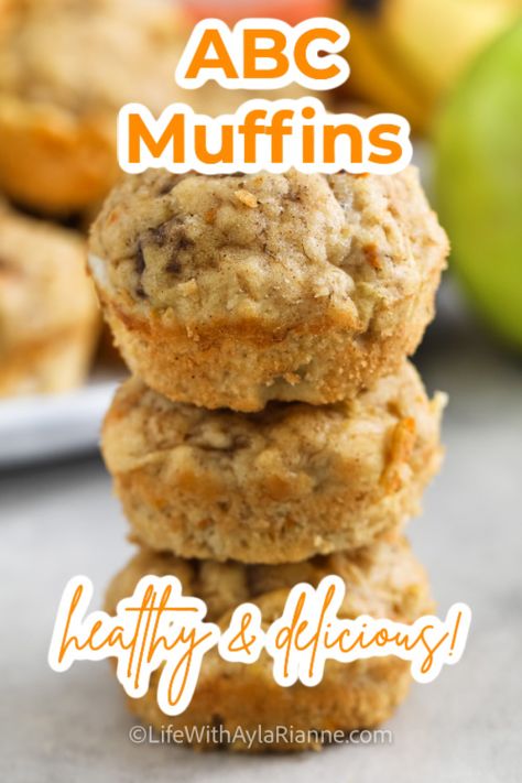 pile of ABC muffins with writing Apple Carrot Recipes Healthy, Healthy Apple Banana Muffins, Carrot And Apple Recipes, Healthy Banana Muffins For Toddlers, Easy Breakfast Muffins For Kids, Apple Banana Carrot Muffins, Toddler Snacks With Banana, Abc Muffins Toddler, Oatmeal Carrot Apple Muffins