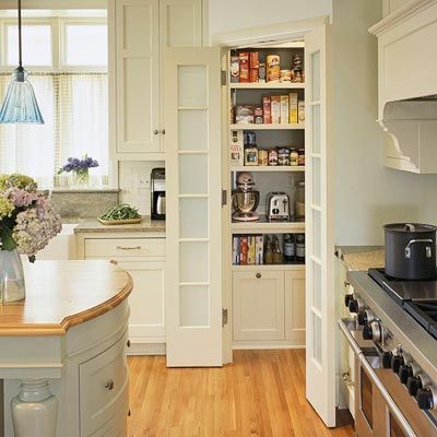 Corner Pantry              Split-door corner pantries are perfect for small kitchens with unused corner space. Here, the corner pantry helps keep walkways clear. Inside the pantry, custom shelving offers ample storage for food, supplies, and small appliances Kitchen Corner Pantry, Corner Pantry Ideas, Corner Pantry Cabinet, Corner Kitchen Pantry, Kitchen Pantry Furniture, Kitchen Pantry Doors, Pantry Layout, Pantry Furniture, Kitchen Ikea