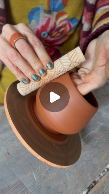 Nicola Moore ✄ - - - on Instagram: "I’m excited to get back into the studio after what feels like a huge, and super lovely break visiting family and friends in Australia.

Here, I’m adding a little texture to the outside of this ritual cup with a texture roller. I’m looking forward to seeing this texture, and the play of light on it, under a shimmering luster glaze! 🙌🥰✨ 

I have lots of pieces waiting to be bisque fired on my return. Let’s hope the jet lag isn’t too brutal. I always find going this direction, back to Los Angeles, harder. But there could also be a bit of post trip come down at play… 😉

⁣
.⁣
.⁣
.⁣
.⁣
.⁣
#pottery #earthenware #wheelthrownpottery #pottery #claytherapy #potterytexture #wheelthrownpottery #ceramics #claysurface #ceramiccup #clay #stampingclay #clayprocess" Surface Decorations, Earthenware Pottery, Surface Decoration, Clay Mugs, Wheel Thrown Pottery, Pottery Techniques, Jet Lag, Wheel Thrown, Ceramic Cups