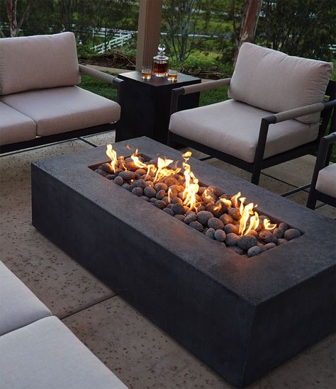 7 Reasons Why a Fire Pit is the Perfect Addition to Your Summer Evenings(and Other Occasions too) 🌃🔥Article out now | #starfire #starfiredirect #gasfirepits #outdoorliving #patiodesign #landscapingdesign #QualityMaterials #backyarddesign #backyardinspo #outdoorlivinginspo #summervibes #summer #summernights #outdoorspaces #summerentertainment Gas Fire Pit Ideas Backyard, Fire Pit Balcony, Square Fire Pit Ideas, Modern Outdoor Fire Pit, Modern Outdoor Firepit, Luxury Fire Pit, Garden Ideas Patio, Rectangular Gas Fire Pit, Minimalistic Furniture