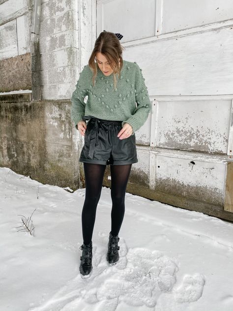 Leather Shorts Holiday Outfit, Leather Shorts Outfit Winter Party, Winter Shorts Outfits Casual, How To Wear Shorts In Winter, Black Leather Shorts With Tights, Shorts And Sweater Outfit Fall, Short Winter Outfit, Faux Leather Shorts Outfit Winter, How To Style Leather Shorts