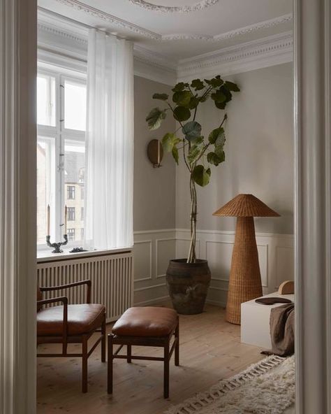 ferm LIVING on Instagram: "Hand-braided from natural rattan, our oversized Dou Floor Lamp celebrates the lovely contrast between geometric shapes and the organic qualities of the material. The shade allows for small glimpses of illumination through the braided rattan, and will add texture and tactility to your living space. Also featured is our Dito Candle Holder. Interior by @kateimogenwood Photo by @stinechristiansen_" Rattan Lampe, Ferm Living, Geometric Shapes, Candle Holder, Floor Lamp, Candle Holders, Living Spaces, Braids, Shades