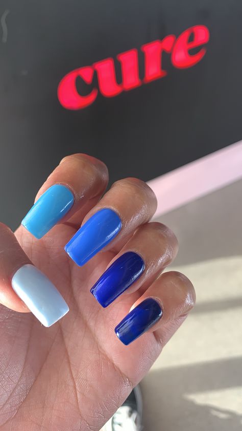 Blue gradient ombré acrylic nails. Different color nails colored Blue Ombre Nails With Design, Plan Color Nails, Blue Multicolor Nails, Different Blue Nails, Color Fade Nails, Ombré Blue Nails, Nail Bleu, Blue Fade Nails, Color Gradient Nails