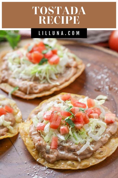 These open-face tostadas are topped with all of your favorite Mexican ingredients! These tasty tostadas are a frequent meal in this house. #tostadas #tostadarecipe #openfacetostadas #mexicanfood #tacos Homemade Spanish Rice, Easy Mexican Dishes, Mexican Ingredients, Farmhouse Recipes, Tostada Recipes, Refried Beans Recipe, Taco Spaghetti, Lil Luna, Mexican Meals