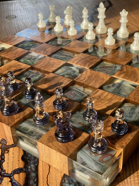 ♟️Pitch chess board or Tar chess setit's remarkable gift.♟️ We offer you custom chess board, carefully assembled chess set. Which will be lavish chess presents, commemoration present for him, 40th birthday celebration present for him, 50th birthday celebration present, customized present e♟️#ChessLife #ChessStrategy #ChessMaster #ChessTactics #ChessCommunity #ChessInspiration #ChessTips #ChessLove #ChessAddict #ChessFun If you want to learn play chess - visit us please)👍 Custom Chess Set, Unique Product Ideas, Unique Chess Sets, Chess Resin, Epoxy Chess Board, Resin Chess Board, Chess Board Table, Resin Chess Set, Handmade Chess Set