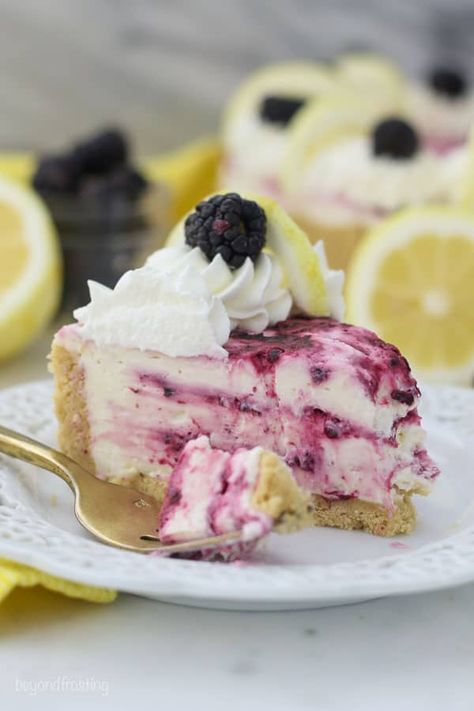 This No-Bake Blackberry Lemon Cheesecake is bursting with all your favorite summer flavor, and doesn’t even require an oven. The cookie crust is filled with a no-bake lemon cheesecake with white chocolate and a blackberry swirl. #lemoncheesecake #nobakecheesecake #nobakelemoncheesecake #lemonblackberry Blackberry Desserts, Rainbow Cheesecake, Beyond Frosting, Lemon Icebox Cake, Blackberry Dessert, Icebox Cakes, Raspberry No Bake Cheesecake, Blackberry Lemon, No Bake Lemon