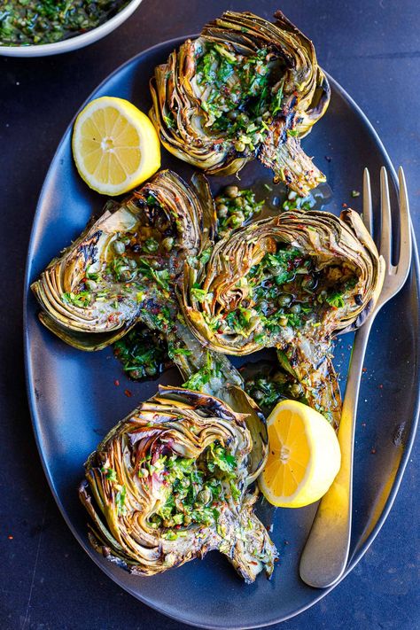 Grilled artichokes are deliciously tender and smoky. Skip the butter and aioli and serve them up Italian style with our punchy Italian Salsa Verde. A tasty vegan appetizer or side dish that presents beautifully! Italian Salsa, Grilled Tandoori Chicken, Vegan Appetizer, Grilled Artichoke, Spring Meals, Lamb Kebabs, Grilled Tofu, Italian Sauce, Artichoke Recipes