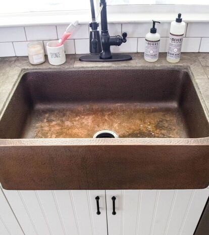 Cleaning your copper farmhouse sink is surprisingly easy and simple. For basic, every day, cleaning simply use a mild soap and water, that’s it! Nothing fancy no bleach or ajax here.For a deep clean you will need to use a copper cleaning kit. I use the same brand cleaning kit as my sink, which is Sinkology. The process is quick and easy! Clean Out Sink Start with an empty sink and you can either dry it or leave it wet for this. Fact: the items that make the copper change colors… How To Clean Copper Sink, Bathroom Light Fixtures Ceiling, Copper Farmhouse Sink, Remove Water Spots, Colored Sinks, Hammered Copper Sink, Faux Fireplace Mantels, Fireplace Mantel Surrounds, How To Clean Copper