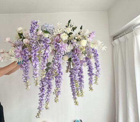 Purple Wisteria Wedding Archway Flower Artificial/ Lavender Hanging Wisteria Flower Swag/ Lilac Flower Cascades/ Wisteria Chandelier Bridal Size Details: - 125 x 85cm/ 4.1 x 2.8ft  If you need any difference size, or matching archway, swag and tieback, garland, cake topper, centerpieces or hairpieces, please message me for a quote. Tailor made service are available, please send me your ideas for further discussion :) Jump to my shop here:  www.babysbreathbysarine.etsy.com My Instagram:  https:// Wisteria And Roses, Lilac Navy Wedding, Wisteria Centerpiece, Wisteria Wedding Arch, Purple Wisteria Wedding, Wisteria Wedding Colors, Wisteria Wedding Decor, Wisteria Chandelier, Wisteria Bouquet