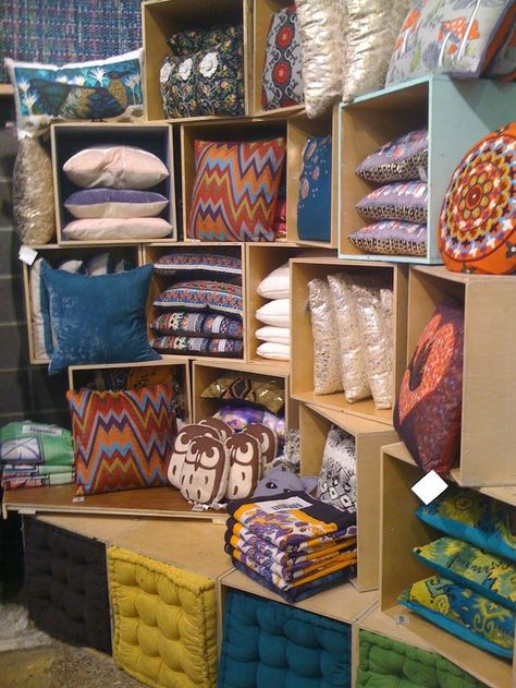 pillow display  store display. Visual merchandising. Boxes stacked to house pillows. Could use this idea instead of a craft fair table. Pillow Display, Craft Fair Table, Display Visual Merchandising, Stall Display, Craft Show Booths, Craft Fairs Booth, Craft Booth Displays, Craft Stalls, Craft Fair Displays