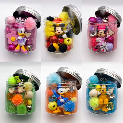 Mickey and friend play dough sensory jars for kids Playdough Sensory Jars, Mickey Sensory Bin, Play Dough Sensory Jars Diy, Play Dough Sensory Jars, Sensory Party Favors, Play Dough Jars, Mickey And Friends Birthday Party, Friends Party Favors, Sensory Jars