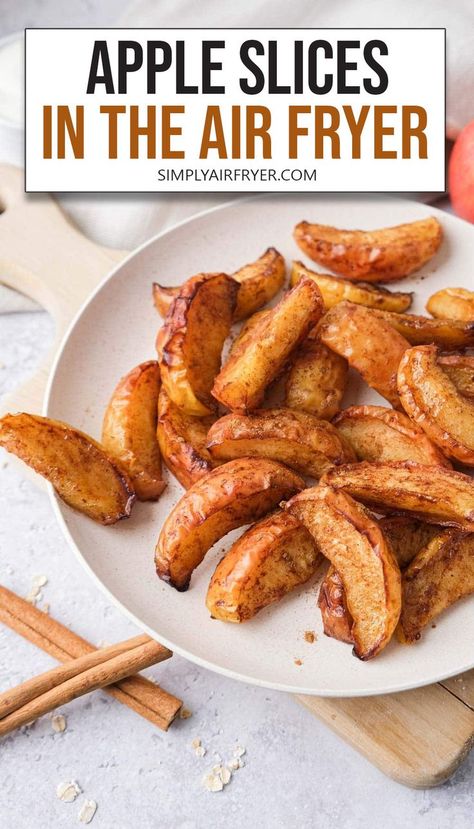 cooked and slightly crispy apple slices on white plate with text overlay "apple slices in the air fryer". Baked Apple Slices, Apple Slice Recipe, Air Fry Recipes, Yogurt And Granola, Fried Apples, Slice Of Heaven, Cooked Apples, Healthy Apple, Air Fryer Healthy