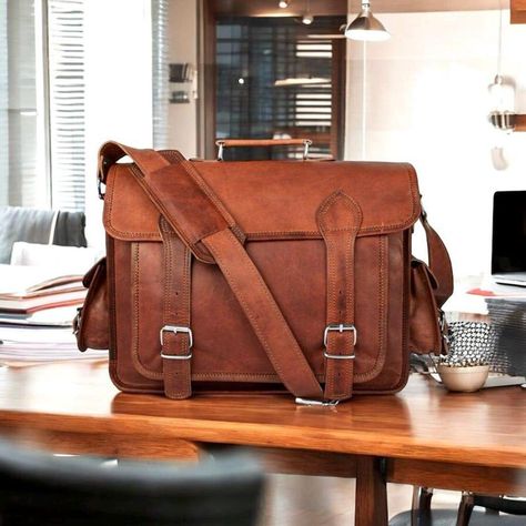 PERSONALIZED PRODUCTS ARE NON-RETURNABLE AND NON-REFUNDABLE UNLESS THEY ARE DAMAGED. Personalized Leather Laptop Messenger Briefcase Men, Monogram Cross Body Computer Sling Satchel Bag, Personalised Groomsmen Gifts FREE SHIPPING || 100% GENUINE LEATHER || 1 YEAR WARRANTY || 30 DAYS RETURN POLICY SHIPPING ➤ Fast shipping through DHL ➤ Ready to ship in 24-48 working hours. ➤ 8-10 Working days delivery for USA, UK, AU, and DE. SIZE AVAILABLE ➤ 11 H x 15 W x 5 D Inches The Messenger Bag with Buckles is in vintage brown color with brass hardware with silver plated to give a stylish and yet sophisticated look. It is diagonally put across the body for a carefree look or carried as a shoulder bag for a more sophisticated look. Salient Features - The Leather Crossbody bag is super spacious with a c