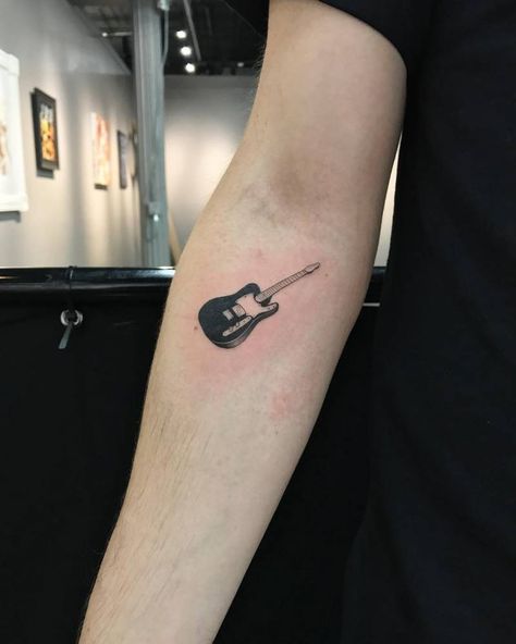 Small guitar tattoo on the right inner forearm. Telecaster Tattoo, Guitar Tattoo For Men, Guitarist Tattoo, Small Guitar Tattoo, Electric Guitar Tattoo, Guitar Tattoo Ideas, Music Guitar Tattoo, Tattoo Guitar, Guitar Tattoos