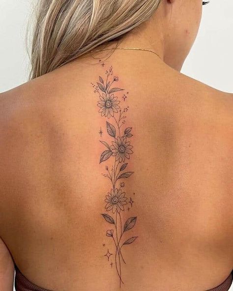 20 Unique And Meaningful Back Tattoos For Women Meaningful Back Tattoos, Back Tattoos For Women, Feminine Back Tattoos, Floral Back Tattoos, Flower Spine Tattoos, Basic Tattoos, Tattoos For Women Flowers, Petite Tattoos, Spine Tattoos For Women